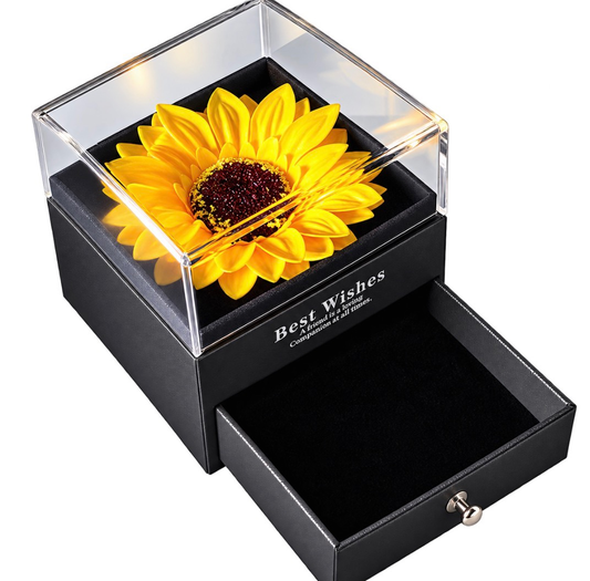 Caja negra con girasol amarillo, tapa transparente y cajón